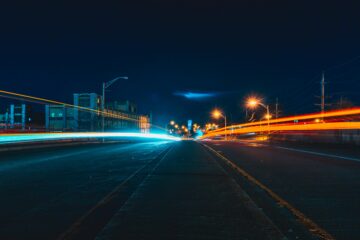 Image of blurred lights simulating driving drunk on the highway at night